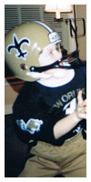 In his Saints uniform on Christmas morning, ready for the pass.