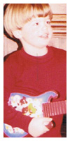 Showing off his guitar skills on Christmas morning.